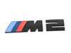 ES#4713490 - 51145A76513 - BMW G87 M2 Trunk Emblem - Black  - Sleek black trunk emblem for BMW G87 M2, bold, sporty. - Genuine BMW - BMW