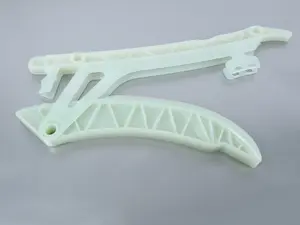 Lower Timing Chain Tensioner With Guide Rail